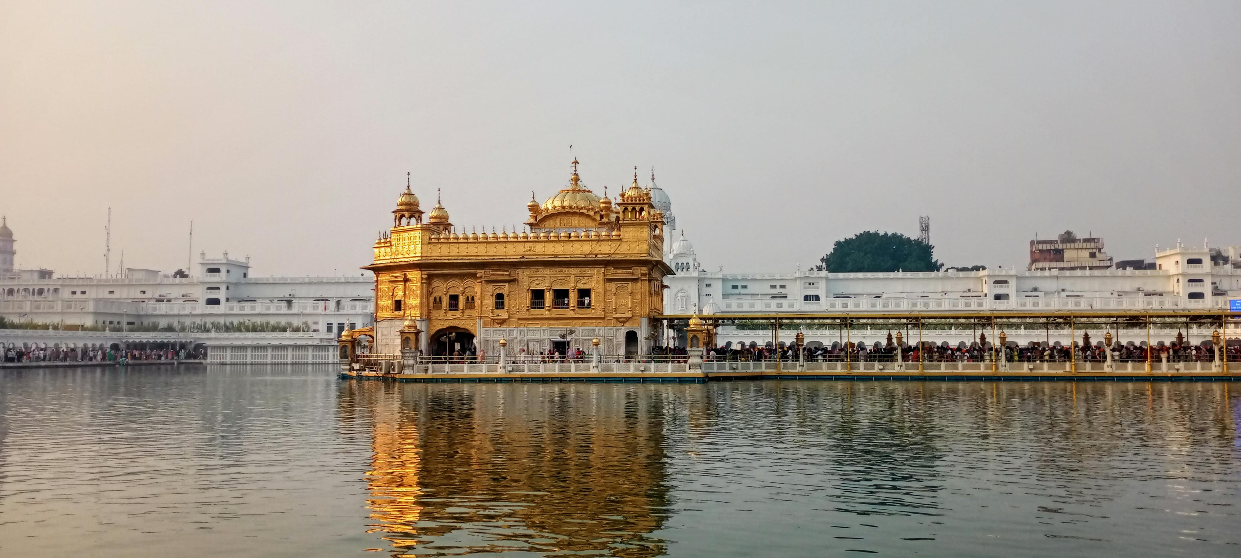 Stunning view of the Golden Temple reflecting in its sacred pool at Amritsar, India.
