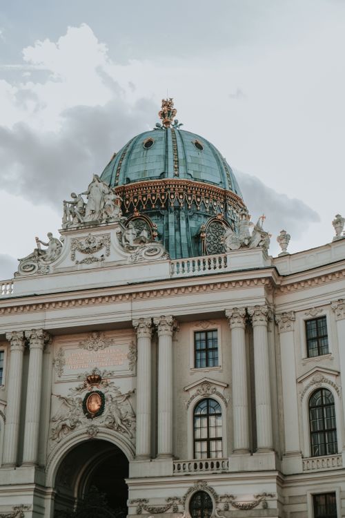 Free Stunning view of baroque architecture featuring a grand dome in Vienna. Stock Photo