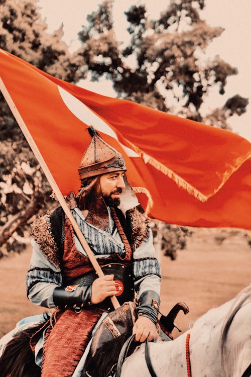 Man with Flag and in Armor on Horse