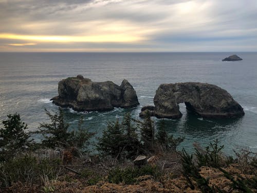 Rocks under Clouds on Sea Shore