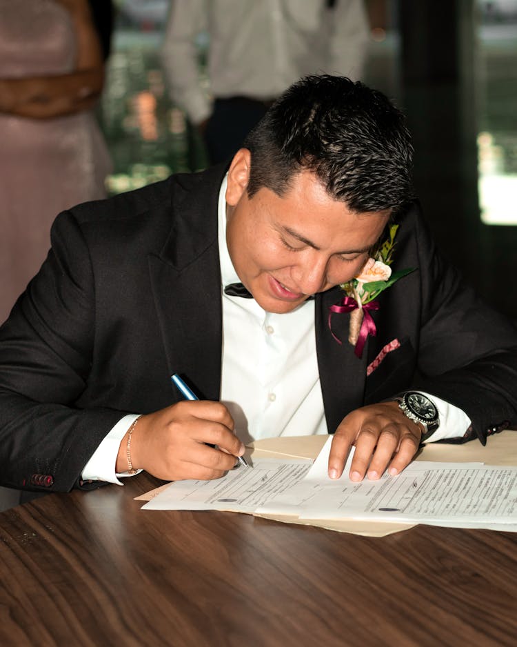 Groom Signing Document