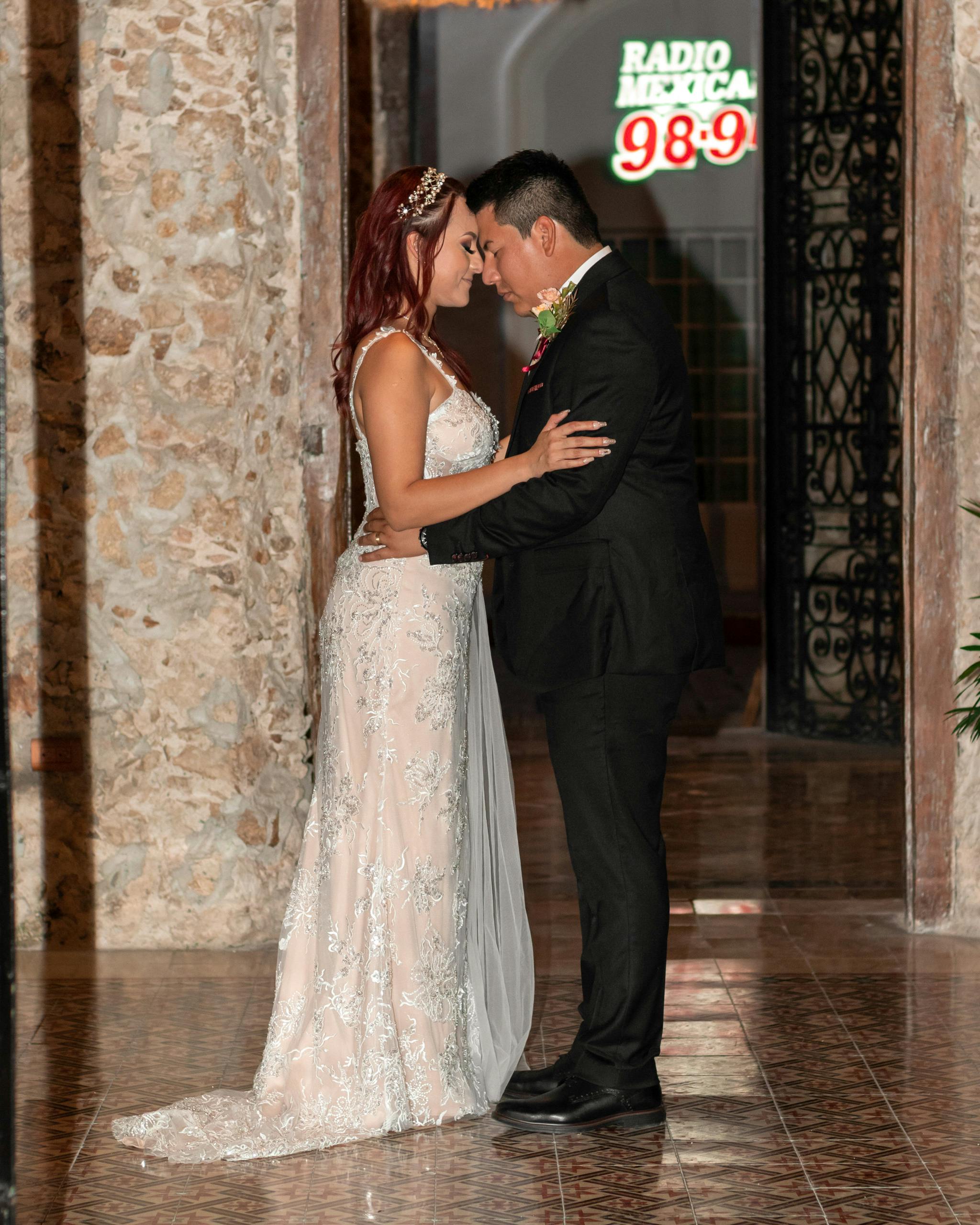 newlyweds standing together and hugging