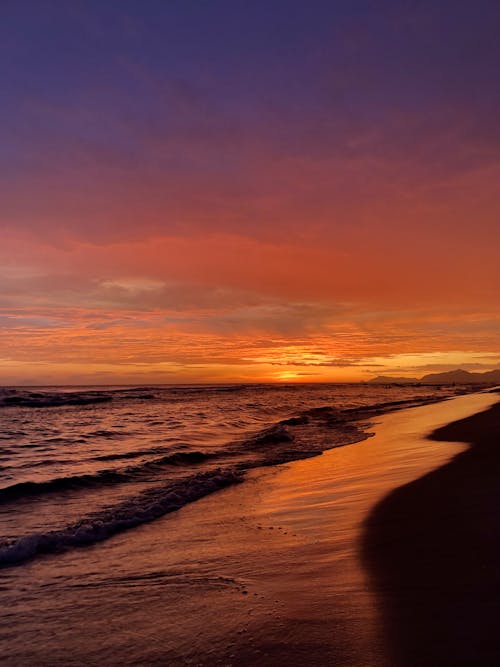 Clouds over Sea Shore at Sunset