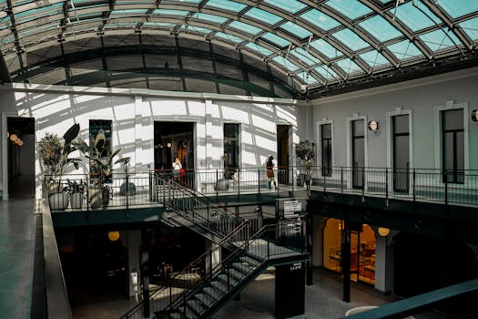 Spacious atrium with a glass ceiling illuminating modern architecture in Ankara, Türkiye.