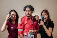 Photo of a Family with Retro Cameras