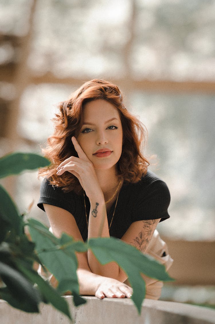 An Adult Woman Posing With Leaves