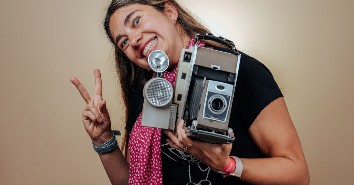 Happy Woman with Old Camera with Stroboscope · Free Stock Photo
