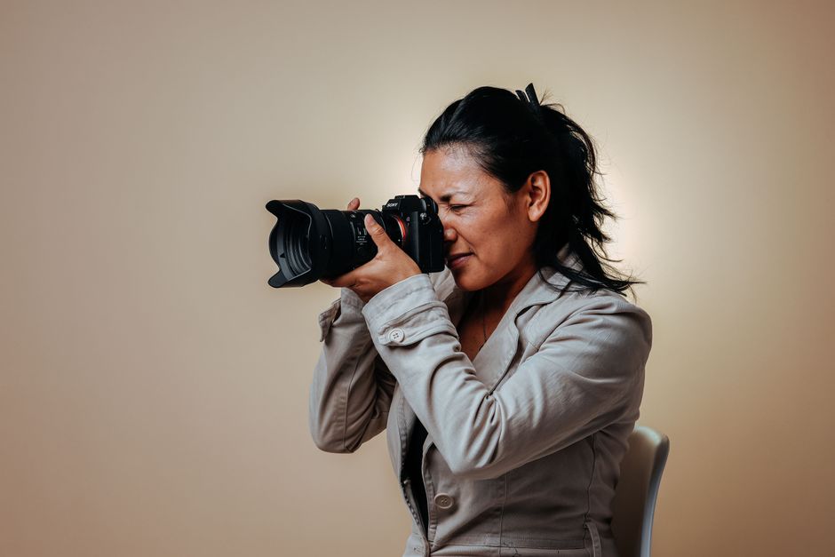 A modern photography studio setup with softboxes, reflectors, and a high-end camera on a tripod - professional studio A modern photography studio setup with softboxes, reflectors, and a high-end camera on a tripod - professional studio