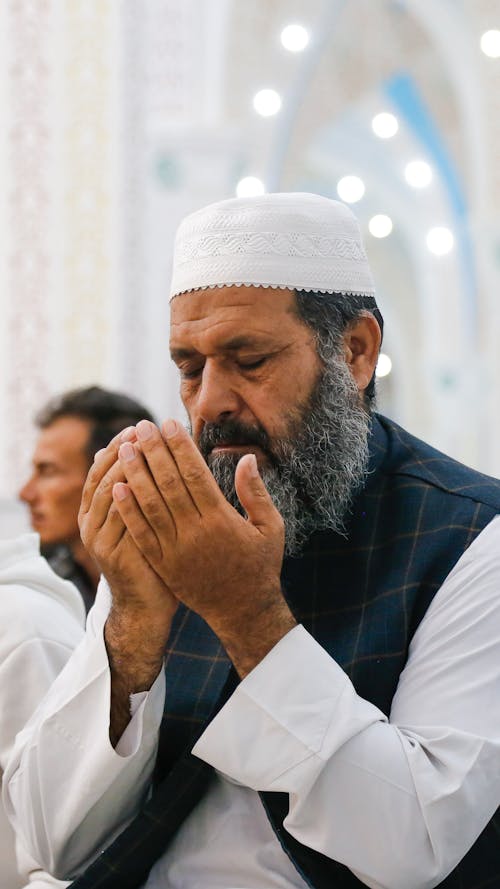 Free Man Praying in Mosque During Ramadan, Iran Stock Photo