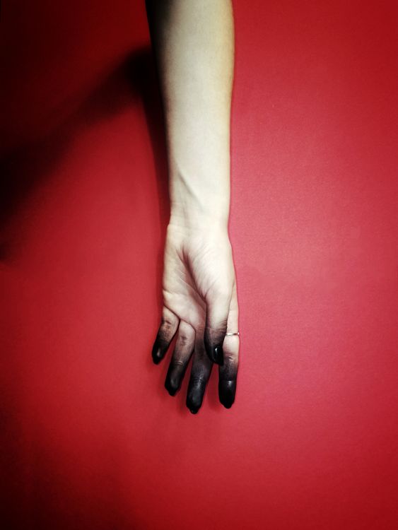 A White Hand on the Red Background · Free Stock Photo