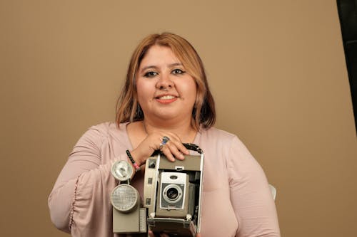 Woman Holding Vintage Camera