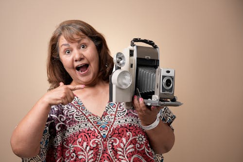 Woman Astonished by Vintage Camera