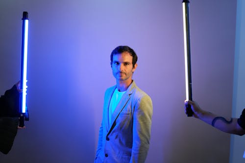 Man in Suit Posing in Blue Light