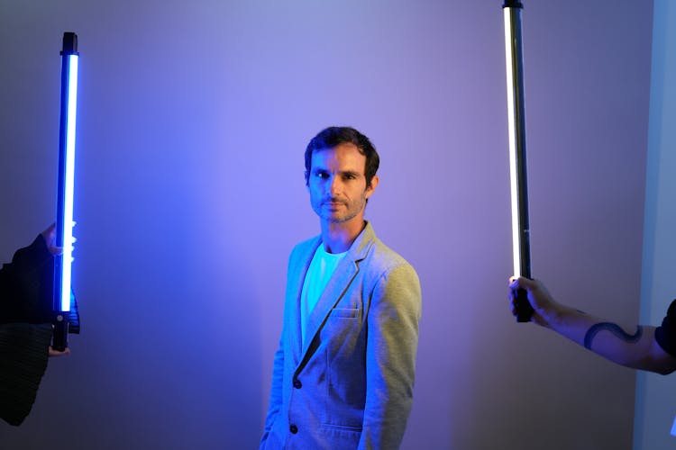 Man In Suit Posing In Blue Light