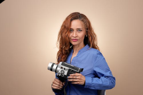 Woman in Shirt Posing with Camera