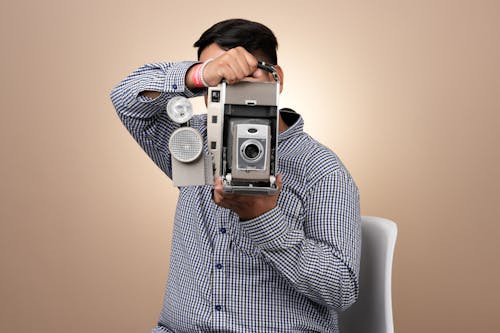 Man Holding Old Fashioned Camera