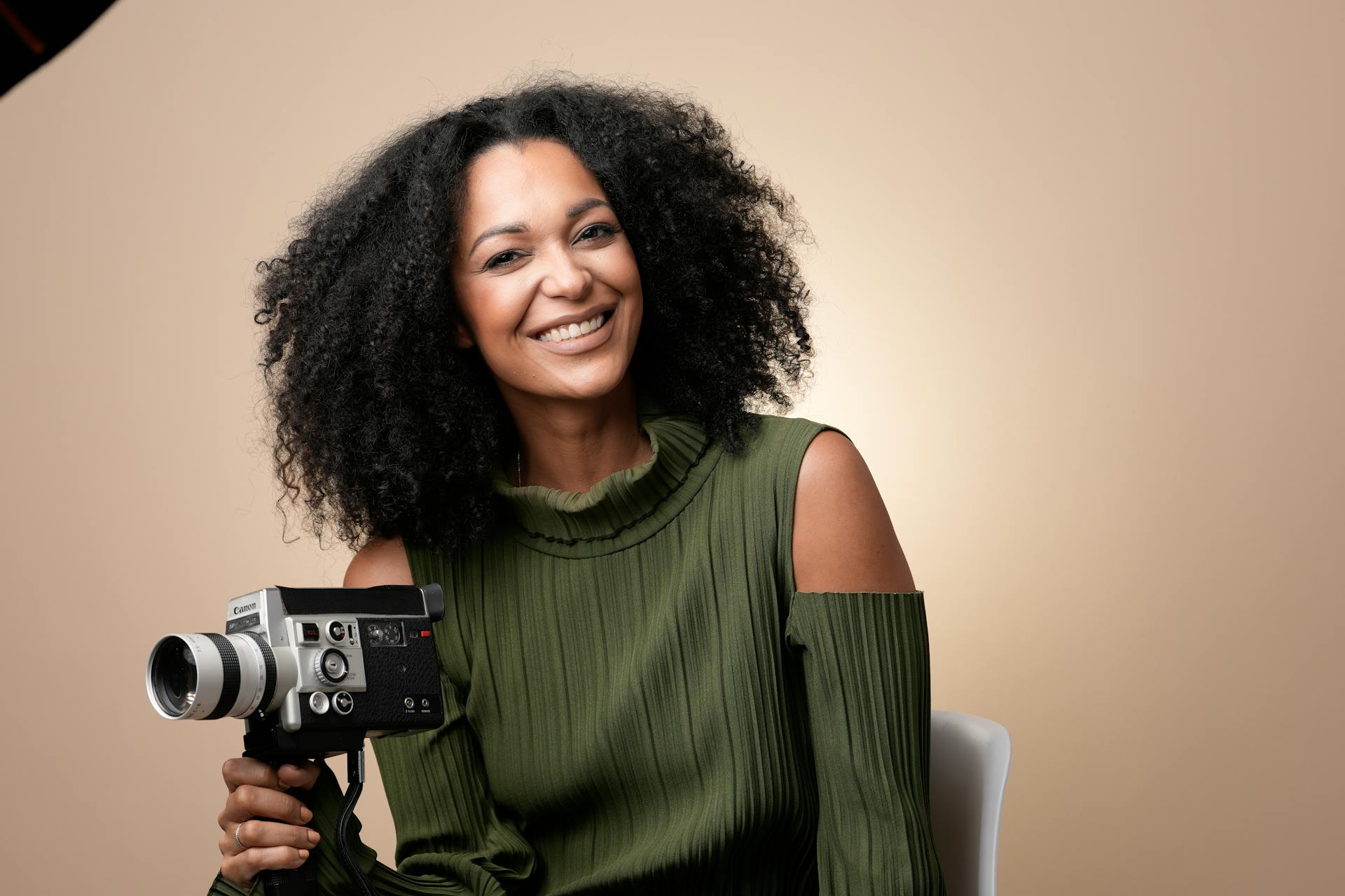 Smiling Woman with Retro Camera