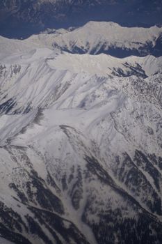 A stunning aerial view of snowcapped mountains, showcasing nature's grandeur and winter beauty.