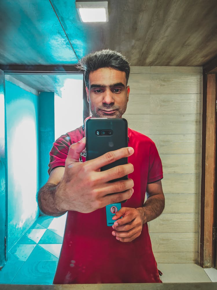 Man Taking A Selfie In Mirror