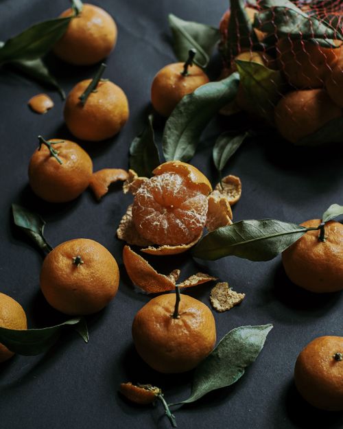 Free Still life photo of fresh mandarins with leaves, showcasing vibrant colors and texture. Stock Photo