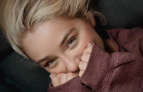 A Portrait of a Blonde Woman Smiling