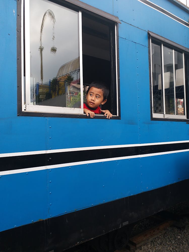 Child Looking Out Of Train Window