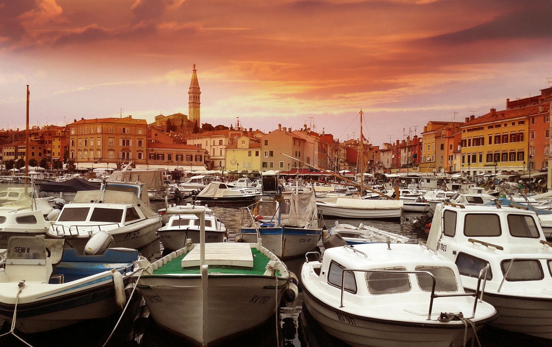 White Yachts on Body of Water during Sunset