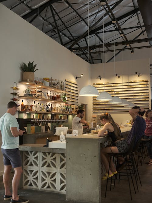 People Sitting at Counter in Cafe