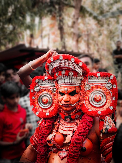 Man in Red God Costume at Festival