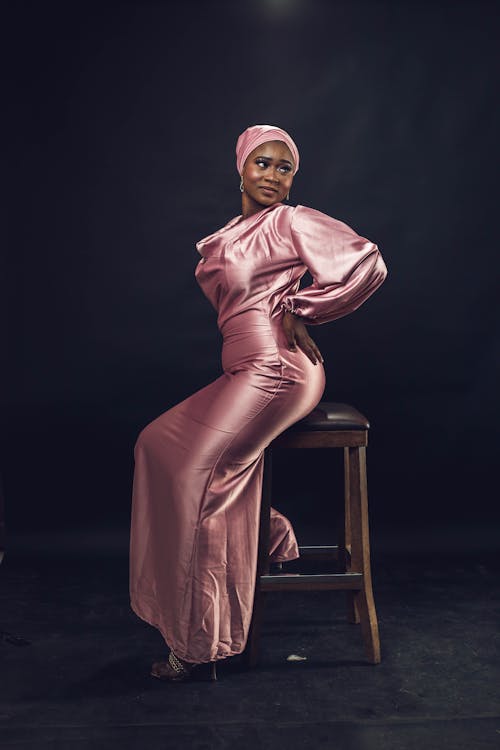 Woman in Pink Satin Dress and Turban