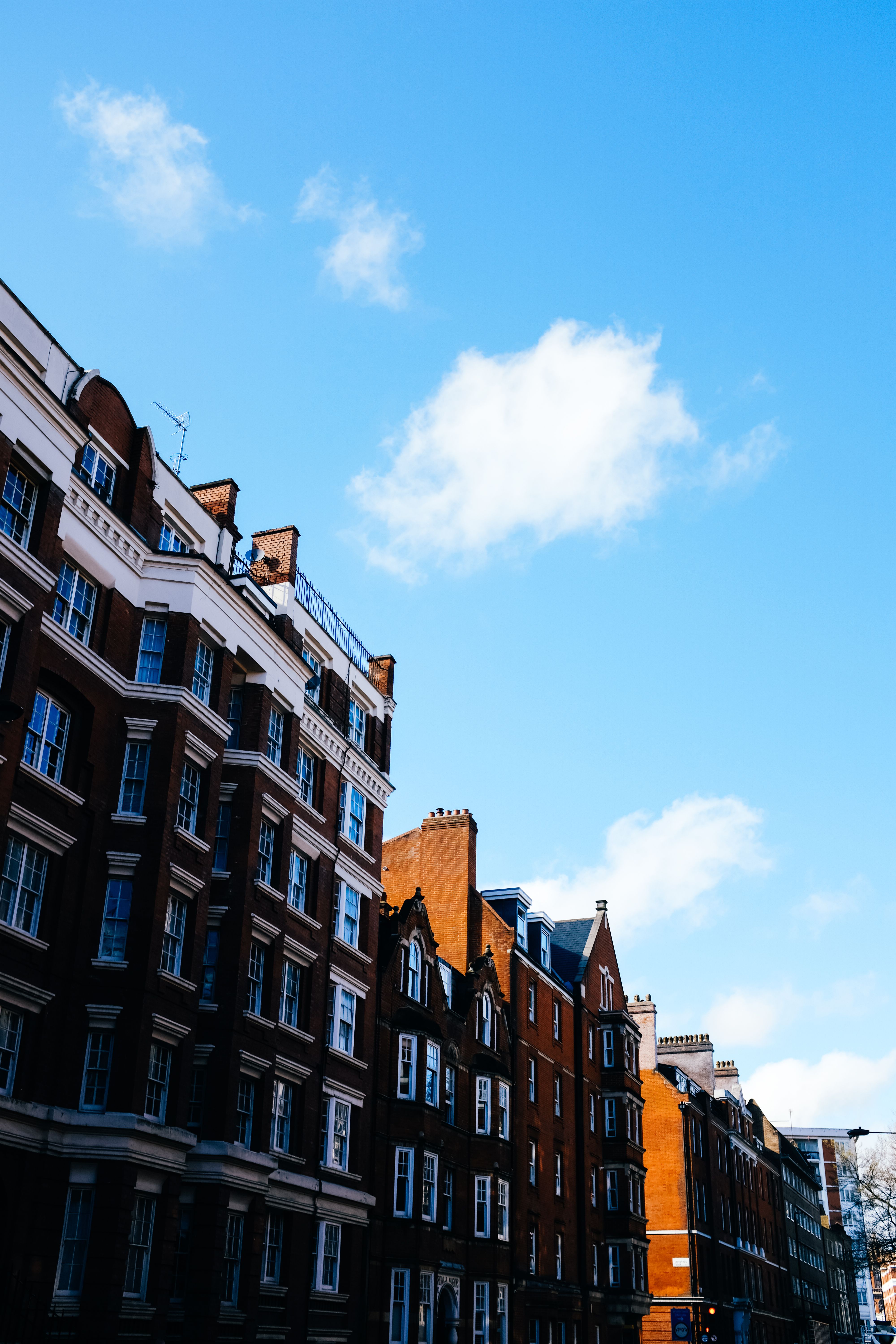 Traditional Apartment Buildings against Blue Sky · Free Stock Photo