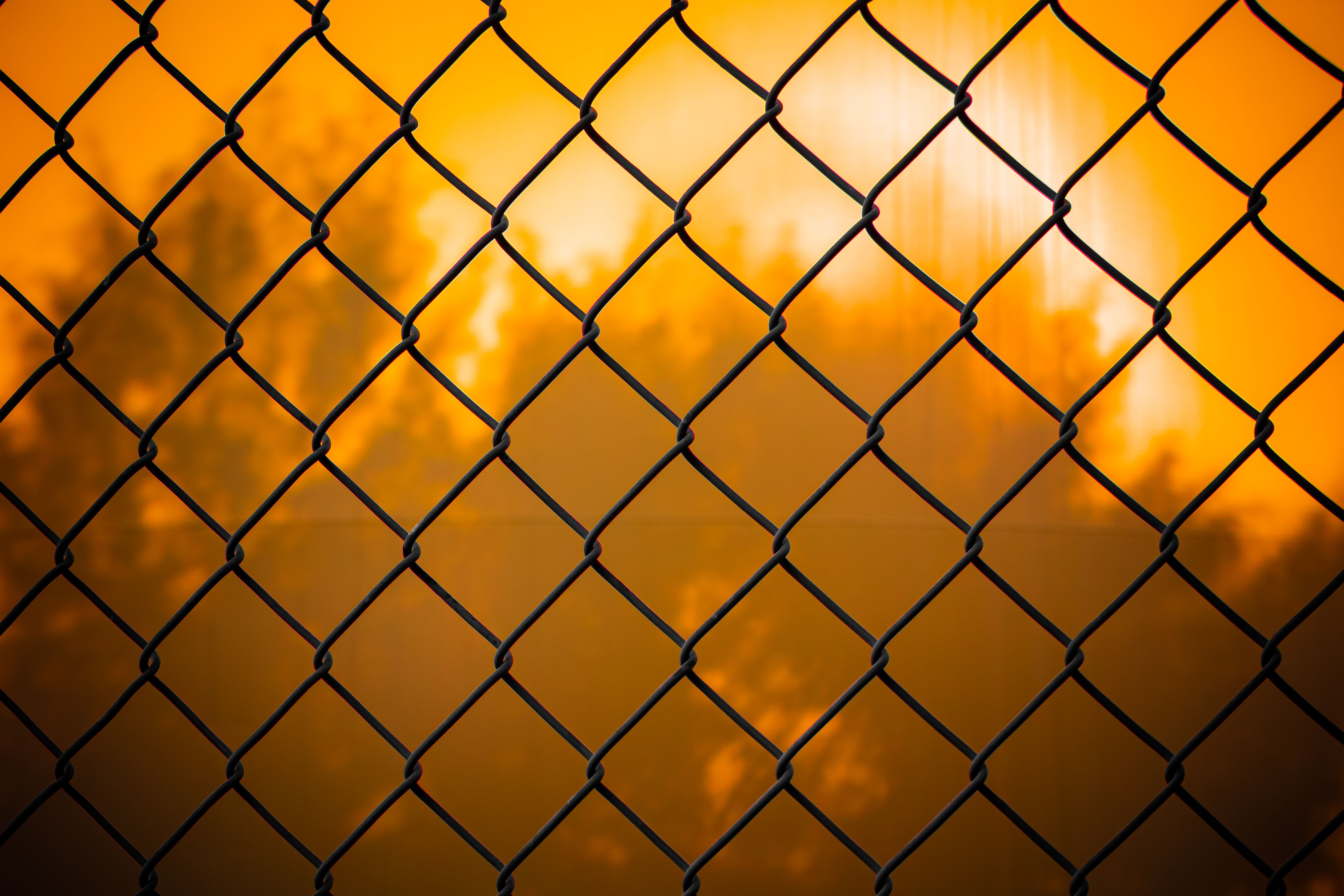 A Fence at Sunset · Free Stock Photo