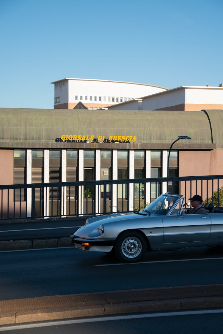 Man Driving Alfa Romeo Spider