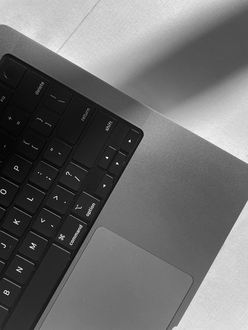 Free Minimalist black and white close-up of a laptop keyboard emphasizing texture and design. Stock Photo