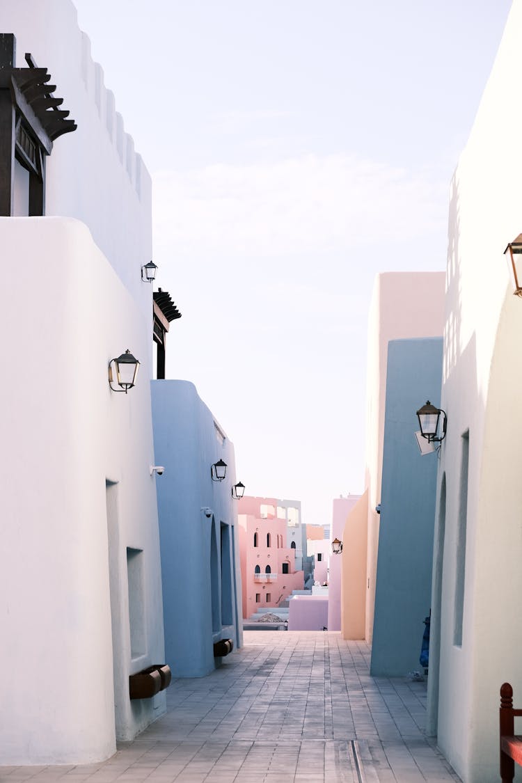 Narrow Street Between White Buildings