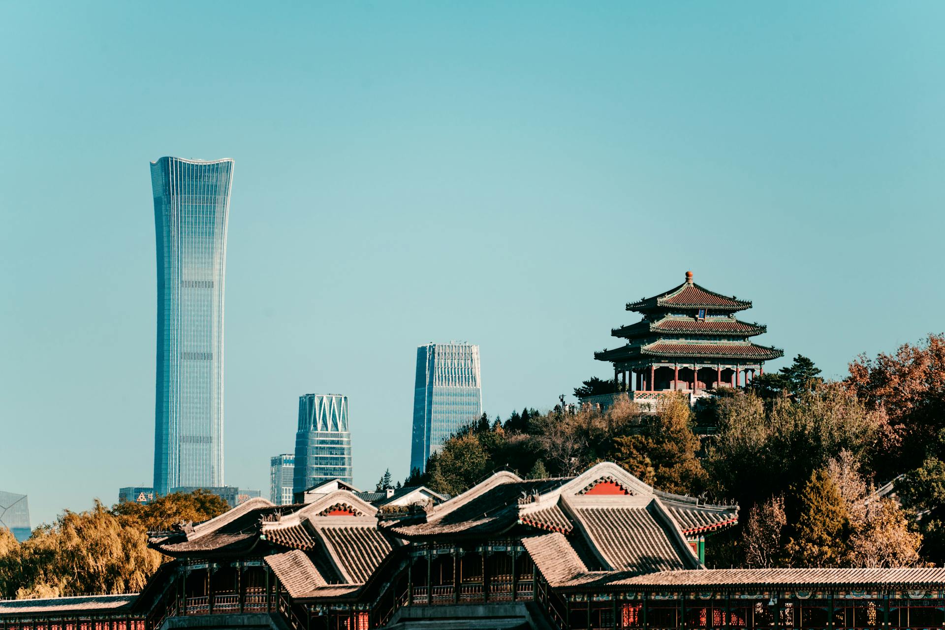 Captivating view of Beijing's skyline featuring traditional architecture and the modern China Zun skyscraper.