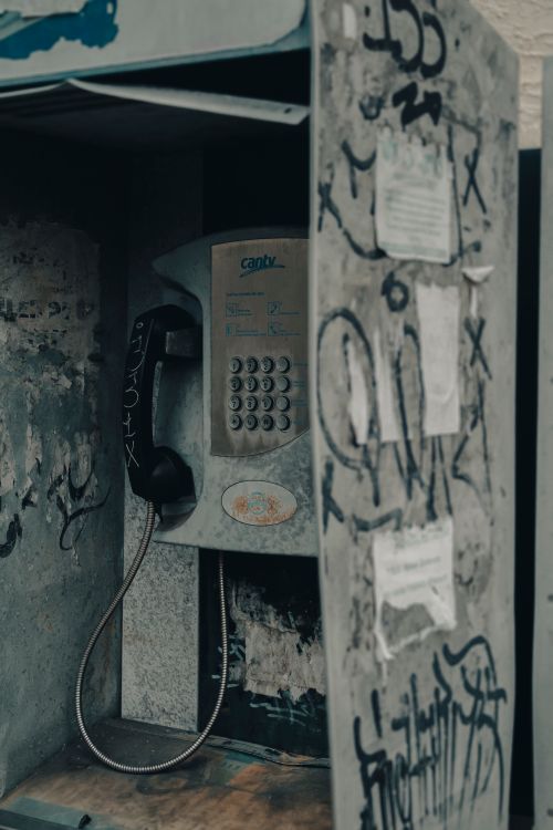 Free Aged phone booth with graffiti, showcasing urban decay in Mérida, Venezuela. Stock Photo