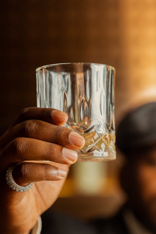 Close-up of Man Holding a Crystal Glass