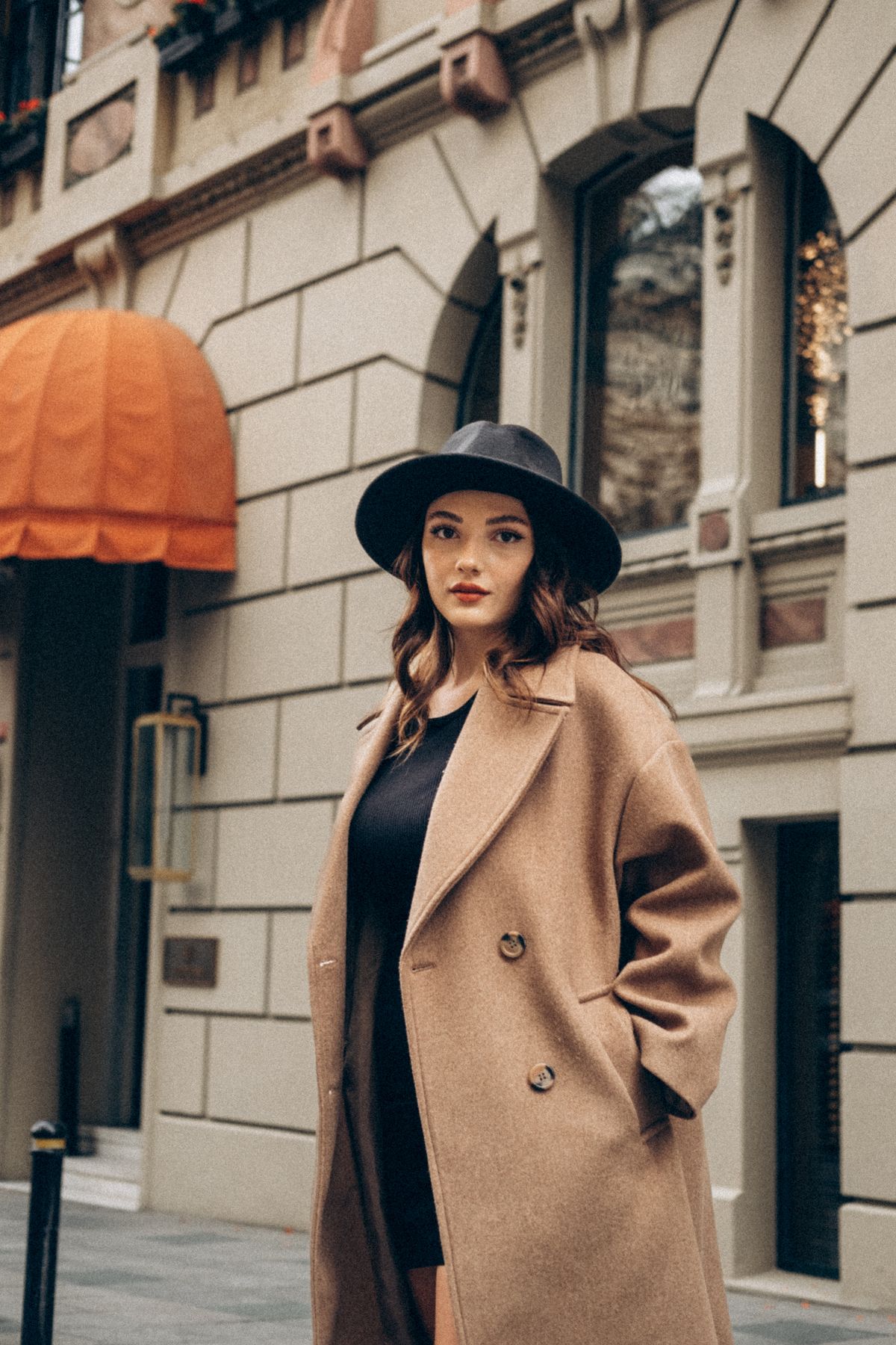 Brown Outfit Ideas for Fall — Camel, Chocolate and Cream Looks for Women Woman in a camel coat and fedora hat on a street