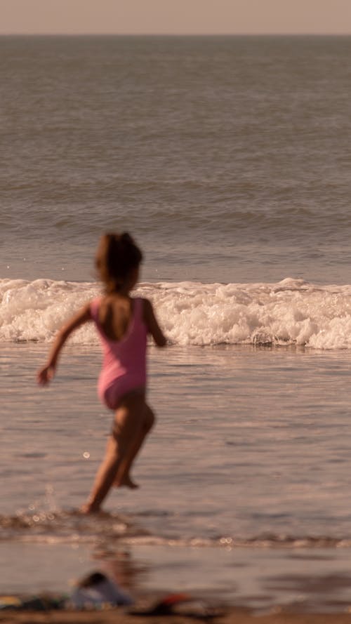 Girl Running on Sea Shore