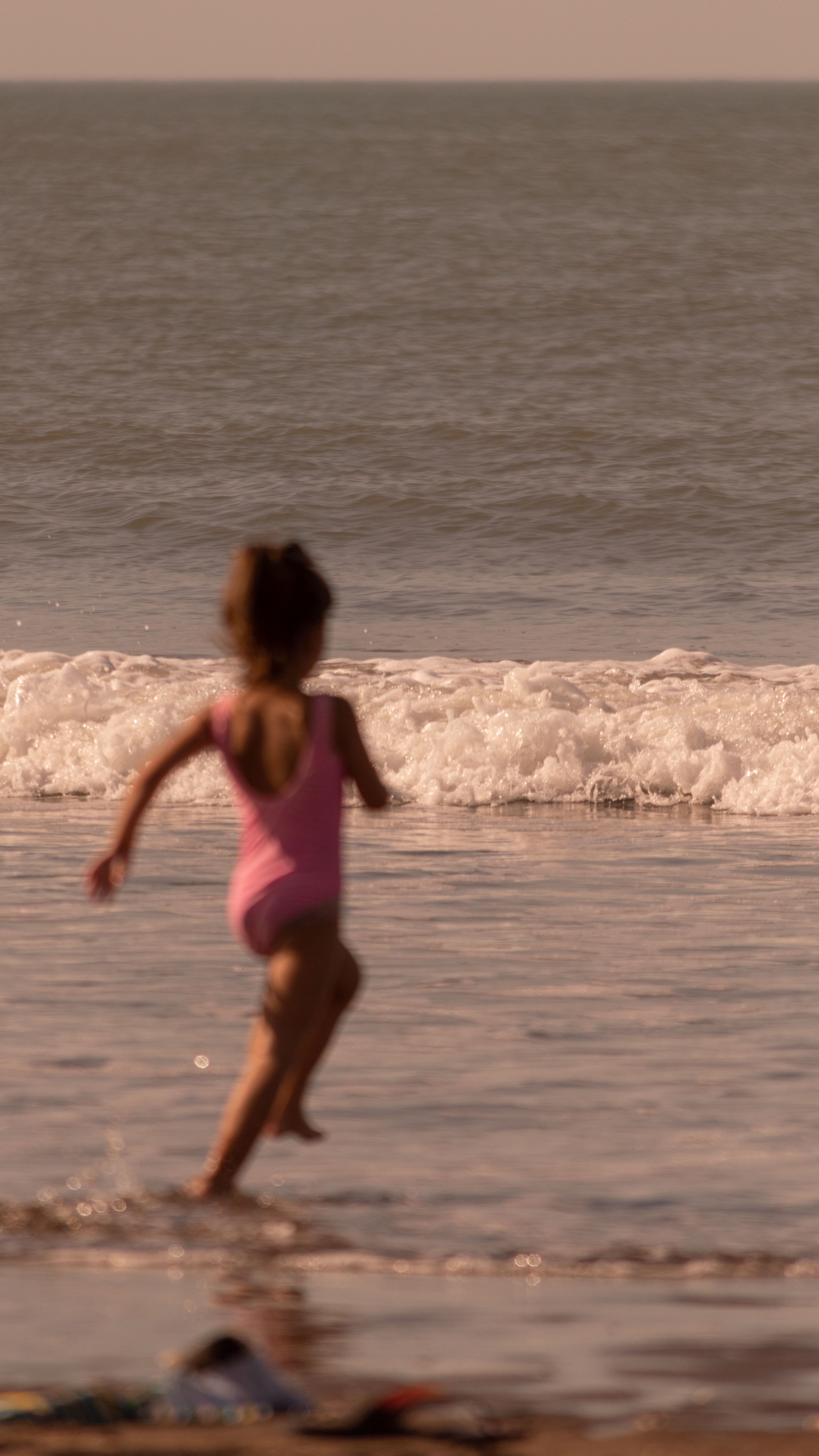 Girl Running on Sea Shore · Free Stock Photo