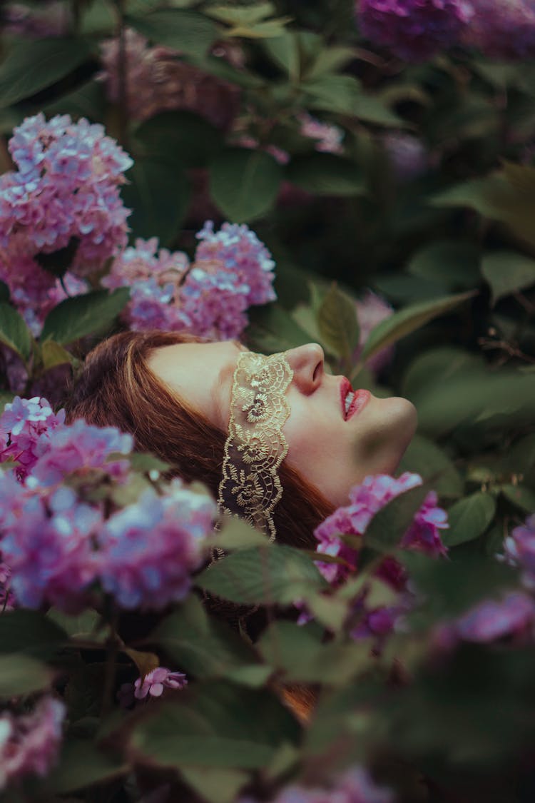 Woman Face Among Flowers