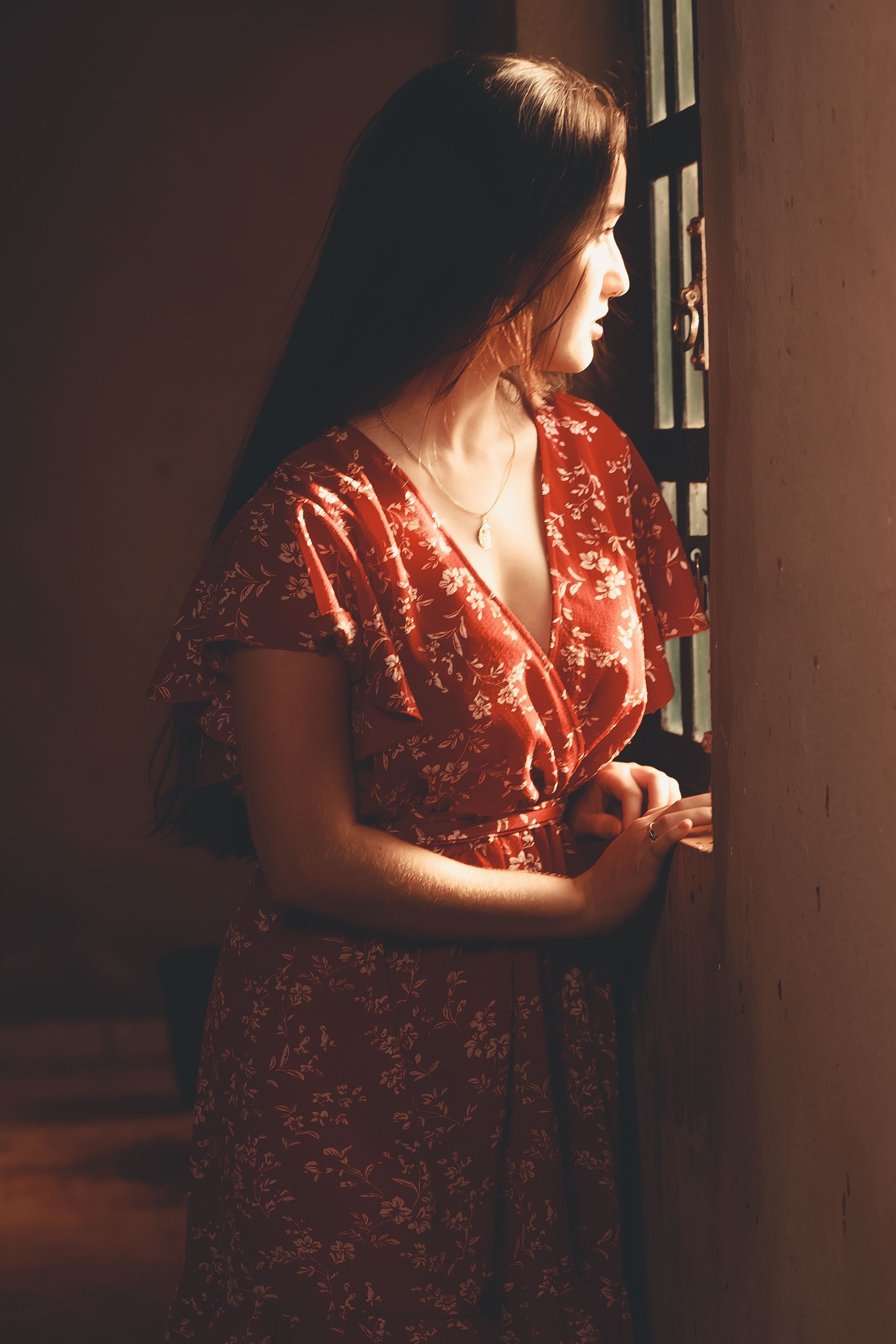 Woman in Red Dress Posing by Windows · Free Stock Photo