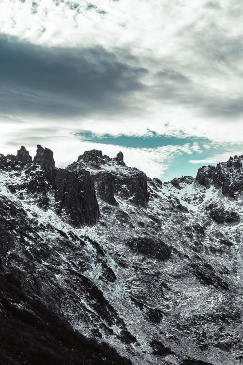 Clouds Above Rocks by the Sea · Free Stock Photo