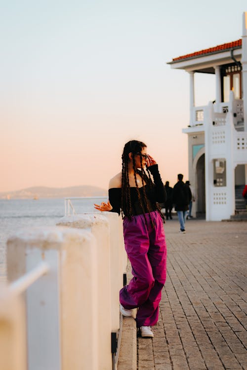 Woman Posing on Promenade by Sea Shore