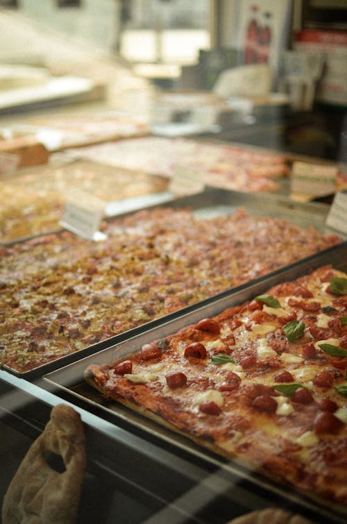 Close-up of Different Kinds of Pizzas on Display 