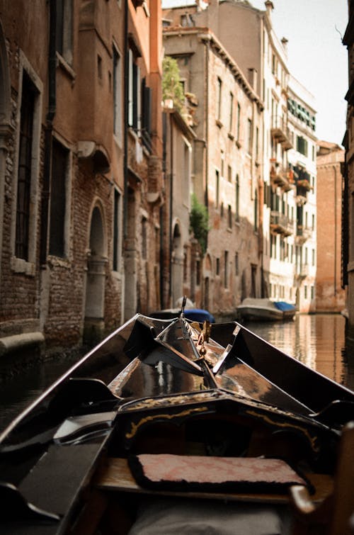 View of the Buildings from a Gondola in a Canal in Venice, Italy 