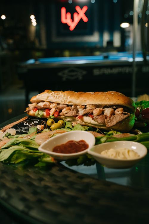 Free Delicious gourmet sandwich with sauces served at the upscale Lux Lounge, Algiers. Stock Photo