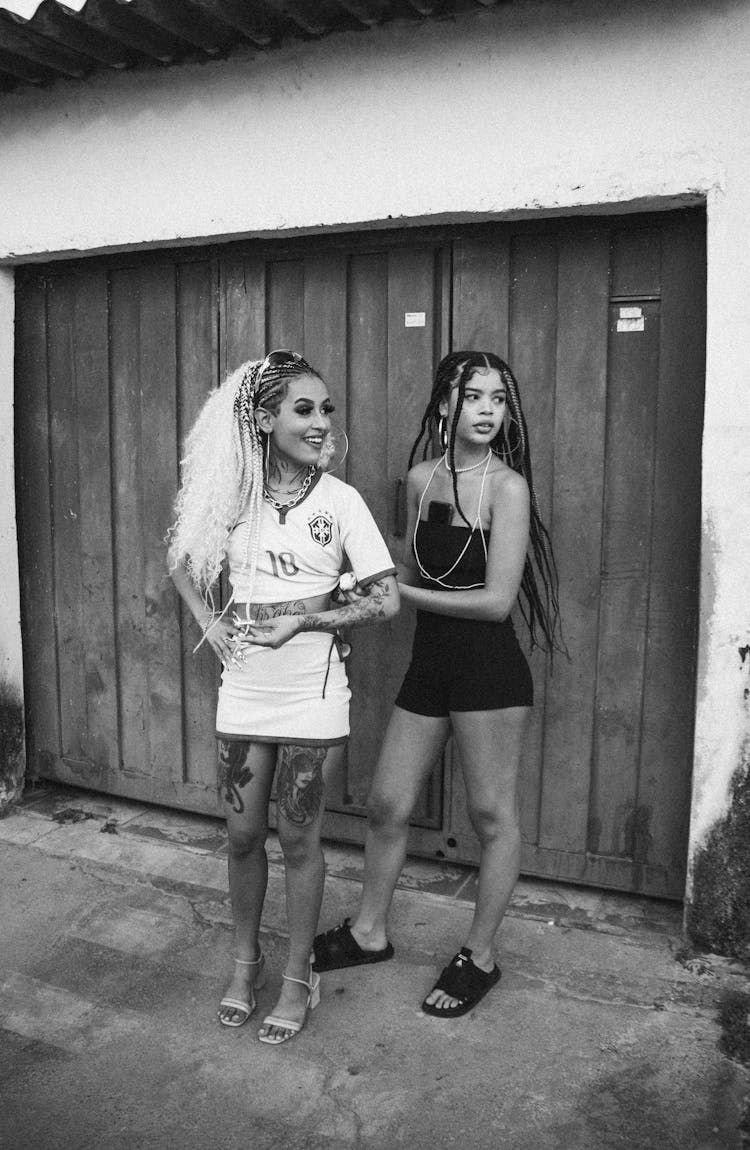 Women Posing By Garage Door