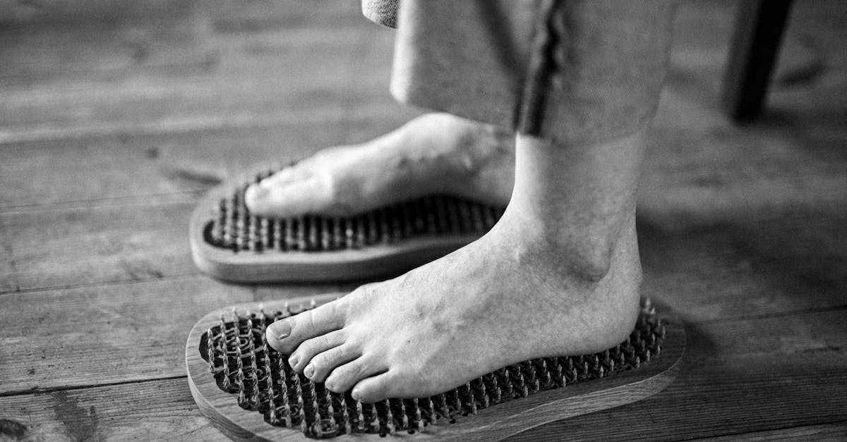 A person's foot with different reflexology points highlighted and labeled for stress relief treatment.
